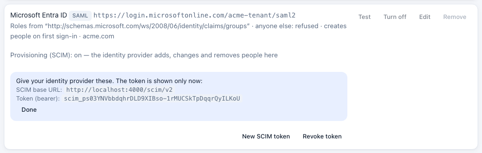 The SCIM base URL and token, shown once